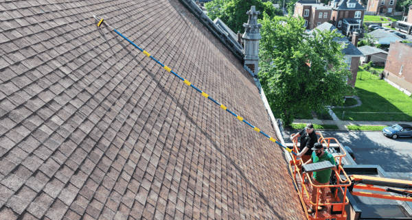 SeekNow field professional documenting a residential roof
