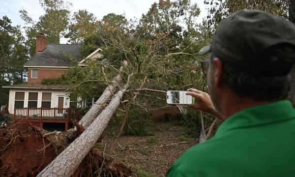 SeekNow field professional documenting a property after a severe weather event
